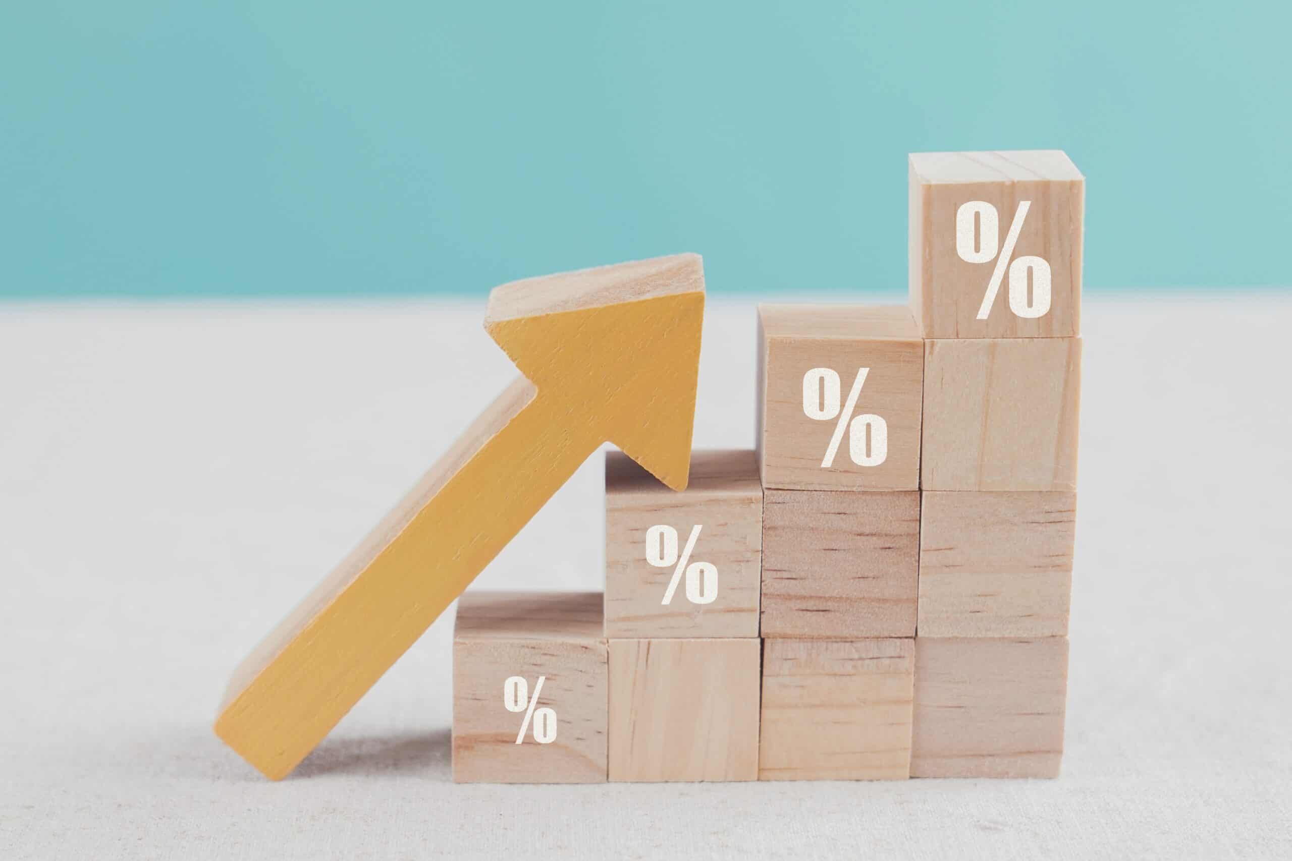 Wooden,Blocks,With,Percentage,Sign,And,Arrow,Up,,Financial,Growth,
